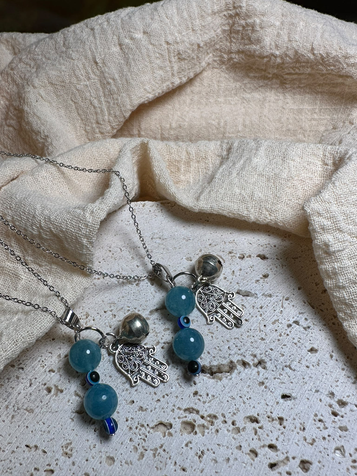 Collana Angelite con Mano di Fatima e Occhio di Nazar